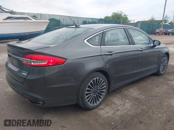 2017 Ford Fusion Titanium with VIN 3FA6P0K96HR208757, listed as a IAAI auction lot 42400172 with 90,000 mi miles and . Bid and sale history available at DreamBid. Image 4.