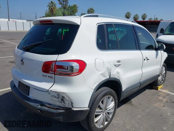 2014 Volkswagen Tiguan SEL with VIN WVGAV3AX9EW512956, listed as a IAAI auction lot 42110002 with 136,034 mi miles and . Bid and sale history available at DreamBid. Image 4.