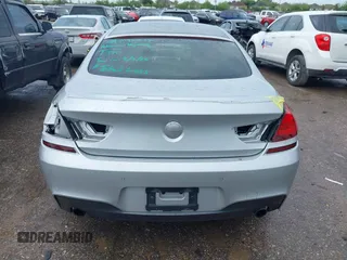 2015 BMW 6 Series 640i z VIN WBA6A0C51FD318982, wystawiony jako IAAI lot #41875547 z przebiegiem 60 968 mil mil oraz . Historia ofert i sprzedaży dostępna na DreamBid. Obrazek 6.