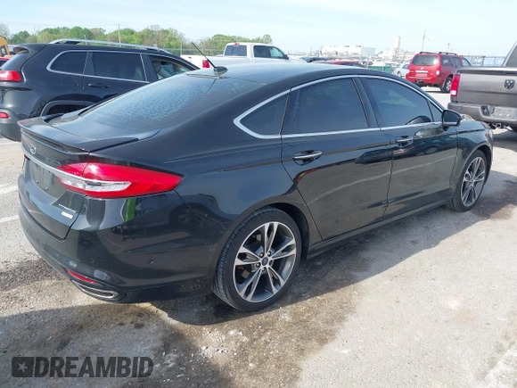 2017 Ford Fusion Titanium with VIN 3FA6P0K91HR257462, listed as a IAAI auction lot 42079361 with 124,914 mi miles and . Bid and sale history available at DreamBid. Image 4.