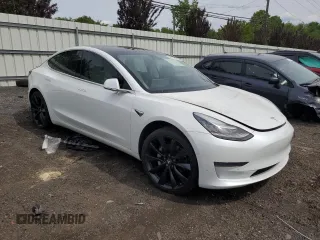 2019 Tesla Model 3 Mid Range z VIN 5YJ3E1EA2KF486532, wystawiony jako Copart lot #58082635 z przebiegiem 51 920 mil mil oraz Tytuł czysty. Historia ofert i sprzedaży dostępna na DreamBid. Obrazek 4.