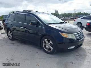 2013 Honda Odyssey Touring with VIN 5FNRL5H92DB003200, listed as a IAAI auction lot 41920237 with 167,483 mi miles. Bid and sale history available at carsss.com. Image 1.