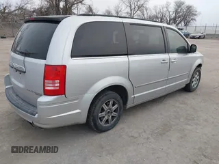 2010 Chrysler Town & Country Touring with VIN 2A4RR5D18AR466614, listed as a IAAI auction lot 41824475 with 242,881 mi miles. Bid and sale history available at carsss.com. Image 4.