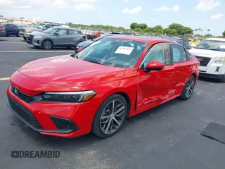2023 Honda Civic Touring with VIN 2HGFE1F94PH323451, listed as a IAAI auction lot 42383422 with 6,120 mi miles and . Bid and sale history available at DreamBid. Image 17.