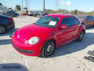 2012 Volkswagen Beetle 2.5L with VIN 3VWJX7AT5CM648739, listed as a IAAI auction lot 41547850 with 214,941 mi miles. Bid and sale history available at carsss.com. Image 2.