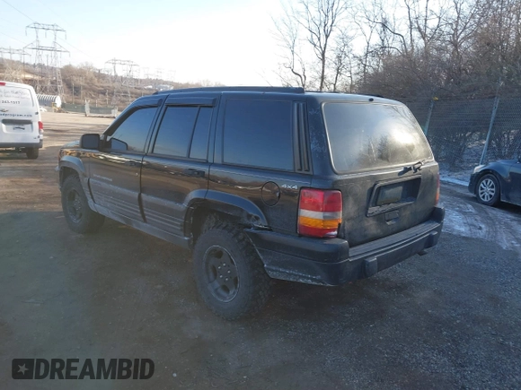 1996 Jeep Grand Cherokee Laredo with VIN 1J4GZ58S3TC197587, listed as a IAAI auction lot 41423318 with 200,116 mi miles. Bid and sale history available at carsss.com. Image 3.