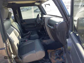 2008 Jeep Wrangler X with VIN 1J4FA24118L646979, listed as a IAAI auction lot 41981709 with 142,081 mi miles and . Bid and sale history available at DreamBid. Image 5.