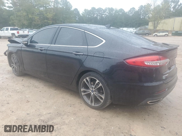 2019 Ford Fusion Titanium with VIN 3FA6P0K9XKR217324, listed as a Copart auction lot 56104185 with 135,728 mi miles and Salvage title. Bid and sale history available at DreamBid. Image 2.