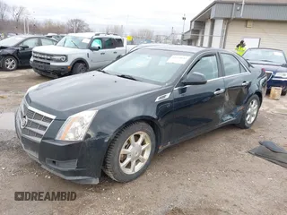 2009 Cadillac CTS AWD z VIN 1G6DG577690116381, wystawiony jako IAAI lot #41944644 z przebiegiem 171 745 mil mil oraz . Historia ofert i sprzedaży dostępna na DreamBid. Obrazek 2.