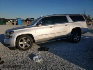 2020 Chevrolet Suburban Premier with VIN 1GNSCJKC9LR198484, listed as a Copart auction lot 87354514 with 115,008 mi miles and Salvage Title. Bid and sale history available at carsss.com. Image 1.