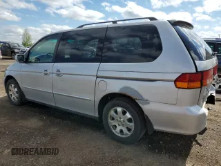 2002 Honda Odyssey EX z VIN 2HKRL186X2H006763, wystawiony jako Copart lot #57317075 z przebiegiem 282 090 mil mil oraz Szkoda całkowita • Salvage title. Historia ofert i sprzedaży dostępna na DreamBid. Obrazek 2.