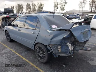 2004 Mitsubishi Lancer ES with VIN JA3AJ26E54U054570, listed as a IAAI auction lot 41592397 with 220,140 mi miles. Bid and sale history available at carsss.com. Image 3.