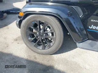 2023 Jeep Wrangler Sahara with VIN 1C4JJXP67PW556933, listed as a IAAI auction lot 41587035 with 20,463 mi miles and . Bid and sale history available at DreamBid. Image 18.