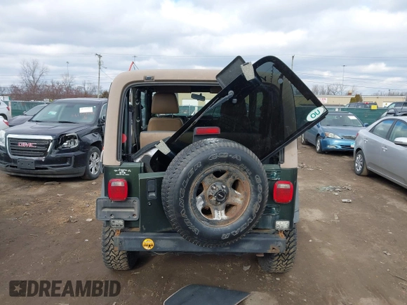 1997 Jeep Wrangler SE with VIN 1J4FY29PXVP406939, listed as a IAAI auction lot 41612380 with 248,314 mi miles. Bid and sale history available at carsss.com. Image 16.