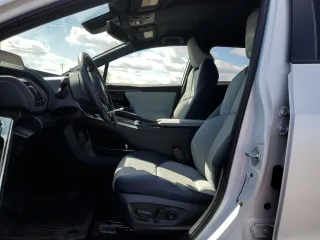 2023 Subaru Solterra Limited with VIN JTMABABA0PA004807, listed as a Copart auction lot 50586815 with 10,879 mi miles and Salvage Title. Bid and sale history available at DreamBid. Image 7.