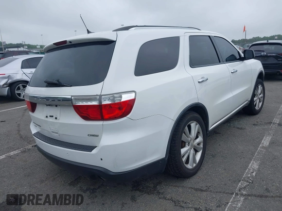 2013 Dodge Durango Crew with VIN 1C4RDJDG4DC518156, listed as a IAAI auction lot 42516880 with 162,402 mi miles and . Bid and sale history available at DreamBid. Image 4.
