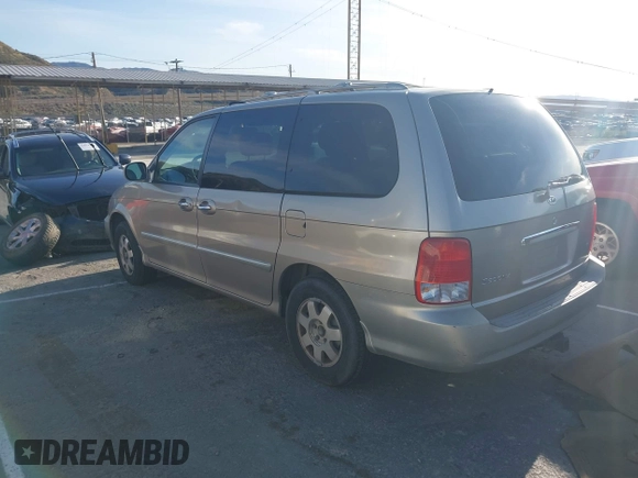 2002 Kia Sedona LX with VIN KNDUP131326280553, listed as a IAAI auction lot 41831101 with 342,242 mi miles. Bid and sale history available at carsss.com. Image 3.