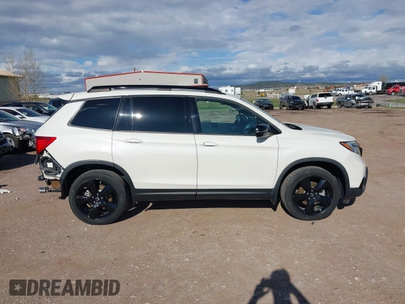 2019 Honda Passport Elite z VIN 5FNYF8H0XKB001472, wystawiony jako IAAI lot #42143890 z przebiegiem 98 119 mil mil oraz . Historia ofert i sprzedaży dostępna na DreamBid. Obrazek 14.