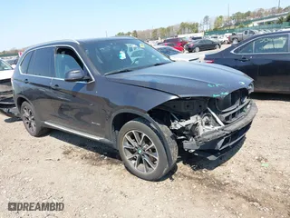 2017 BMW X5 xDrive35i with VIN 5UXKR0C54H0U52386, listed as a IAAI auction lot 42094176 with 128,805 mi miles. Bid and sale history available at carsss.com. Image 1.