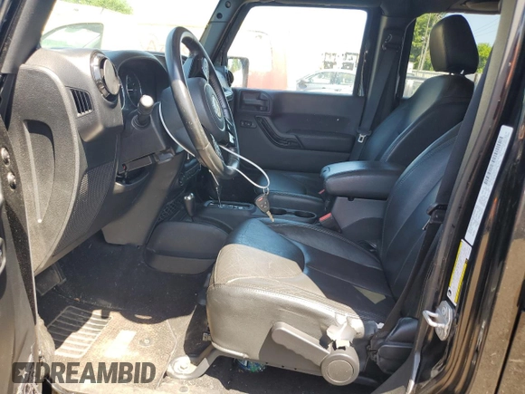 2014 Jeep Wrangler Unlimited Sahara with VIN 1C4HJWEG5EL312006, listed as a Copart auction lot 61821445 with 159,416 mi miles and Salvage title. Bid and sale history available at DreamBid. Image 7.
