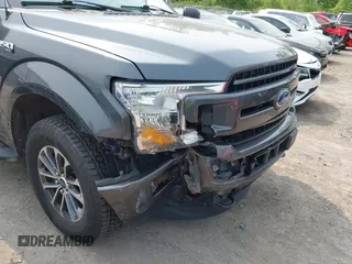 2020 Ford F-150 XL with VIN 1FTEW1EP1LFC21317, listed as a IAAI auction lot 42391410 with 77,999 mi miles and . Bid and sale history available at DreamBid. Image 6.