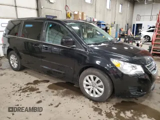 2014 Volkswagen Routan SE with VIN 2C4RVABG5ER135352, listed as a Copart auction lot 51677515 with 136,833 mi miles and Clean title. Bid and sale history available at DreamBid. Image 4.