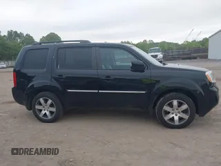 2015 Honda Pilot Touring with VIN 5FNYF4H9XFB036493, listed as a IAAI auction lot 42190624 with 223,675 mi miles and . Bid and sale history available at DreamBid. Image 13.