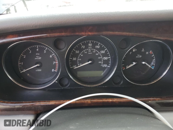 2006 Jaguar XJ with VIN SAJWA71B06SH03941, listed as a Copart auction lot 76013984 with 0 mi miles and Salvage Title. Bid and sale history available at carsss.com. Image 9.