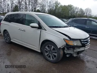 2015 Honda Odyssey Touring Elite with VIN 5FNRL5H98FB076428, listed as a IAAI auction lot 41998339 with 114,573 mi miles and . Bid and sale history available at DreamBid. Image 1.