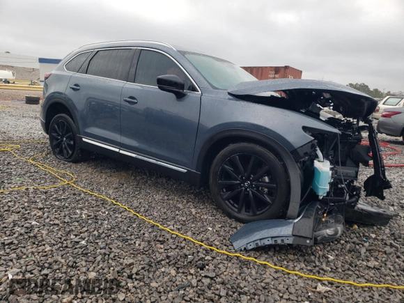 2023 Mazda CX-9 Carbon Edition with VIN JM3TCBDY8P0649319, listed as a Copart auction lot 47799745 with 56,865 mi miles and Salvage Title. Bid and sale history available at carsss.com. Image 4.
