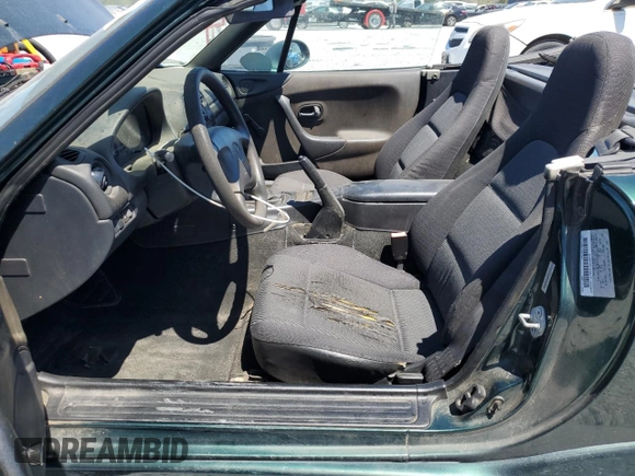 1999 Mazda MX-5 Miata with VIN JM1NB3530X0118452, listed as a Copart auction lot 53337575 with 150,574 mi miles and Clean title. Bid and sale history available at DreamBid. Image 7.