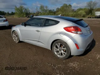 2017 Hyundai Veloster Value Edition z VIN KMHTC6AD8HU318621, wystawiony jako Copart lot #55346755 z przebiegiem 143 901 mil mil oraz Tytuł czysty. Historia ofert i sprzedaży dostępna na DreamBid. Obrazek 2.