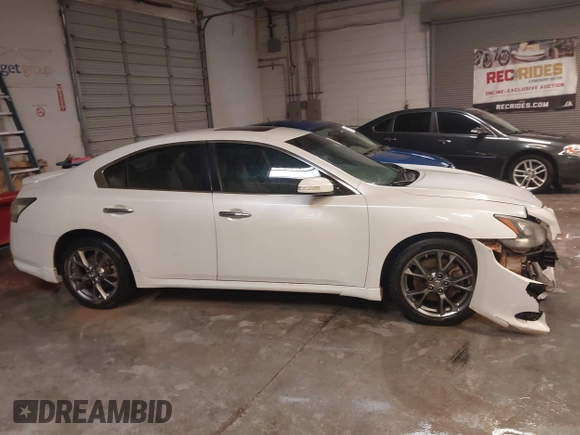 2014 Nissan Maxima SV z VIN 1N4AA5APXEC478724, wystawiony jako IAAI lot #41335407 z przebiegiem 161 985 mil mil oraz . Historia ofert i sprzedaży dostępna na DreamBid. Obrazek 13.