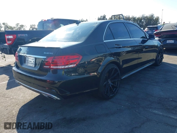 2014 Mercedes-Benz E-Class E 250 BlueTEC Luxury with VIN WDDHF0EB9EA912094, listed as a IAAI auction lot 41651803 with 122,503 mi miles. Bid and sale history available at carsss.com. Image 4.