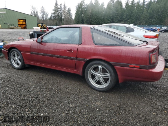 1987 Toyota Supra z VIN JT2MA70J6H0060238, wystawiony jako Copart lot #84754334 z przebiegiem 201 761 mil mil oraz Czysty tytuł • Clean title. Historia ofert i sprzedaży dostępna na DreamBid. Obrazek 2.
