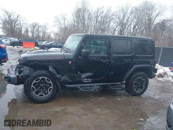 2015 Jeep Wrangler Unlimited Rubicon Hard Rock with VIN 1C4HJWFG9FL569962, listed as a IAAI auction lot 41557801 with 78,597 mi miles and . Bid and sale history available at DreamBid. Image 14.