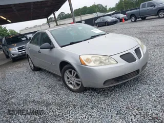 2006 Pontiac G6 6-Cyl z VIN 1G2ZG558464228524, wystawiony jako IAAI lot #42375602 z przebiegiem 172 972 mil mil oraz . Historia ofert i sprzedaży dostępna na DreamBid. Obrazek 1.