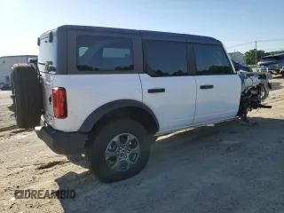 2023 Ford Bronco z VIN 1FMEE5BP7PLC16799, wystawiony jako Copart lot #57847955 z przebiegiem 11 980 mil mil oraz Czysty tytuł • Clean title. Historia ofert i sprzedaży dostępna na DreamBid. Obrazek 3.