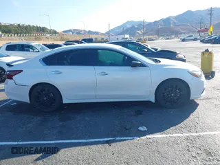 2018 Nissan Altima S with VIN 1N4AL3AP5JC294610, listed as a IAAI auction lot 41436696 with 124,835 mi miles and . Bid and sale history available at DreamBid. Image 13.