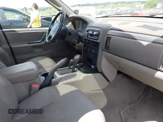 2004 Jeep Grand Cherokee Laredo z VIN 1J8GW48S24C400424, wystawiony jako IAAI lot #42215397 z przebiegiem 122 246 mil mil oraz . Historia ofert i sprzedaży dostępna na DreamBid. Obrazek 5.