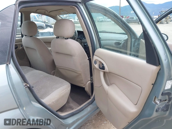 2003 Ford Focus SE z VIN 1FAFP34PX3W135265, wystawiony jako IAAI lot #42354012 z przebiegiem 79 617 mil mil oraz . Historia ofert i sprzedaży dostępna na DreamBid. Obrazek 8.