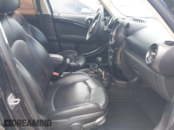 2014 MINI Countryman S with VIN WMWZC3C54EWP26131, listed as a IAAI auction lot 42012162 with 125,869 mi miles and . Bid and sale history available at DreamBid. Image 5.