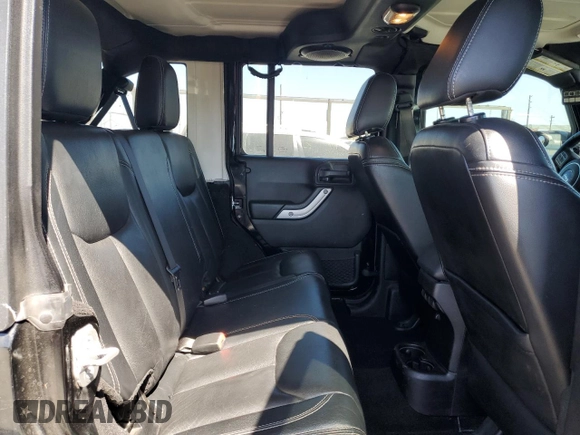 2014 Jeep Wrangler Unlimited Sahara z VIN 1C4BJWEG4EL164226, wystawiony jako Copart lot #53849355 z przebiegiem 82 145 mil mil oraz Szkoda całkowita • Salvage title. Historia ofert i sprzedaży dostępna na DreamBid. Obrazek 11.