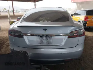 2014 Tesla Model S 60 with VIN 5YJSA1H17EFP35351, listed as a IAAI auction lot 41558434 with 151,002 mi miles and . Bid and sale history available at DreamBid. Image 17.