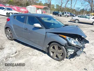 2015 Hyundai Veloster Turbo with VIN KMHTC6AE8FU229198, listed as a IAAI auction lot 41596345 with 74,943 mi miles. Bid and sale history available at carsss.com. Image 1.