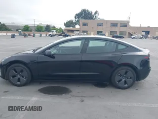 2023 Tesla Model 3 with VIN 5YJ3E1EA5PF647737, listed as a IAAI auction lot 42430145 with 20,525 mi miles and . Bid and sale history available at DreamBid. Image 14.