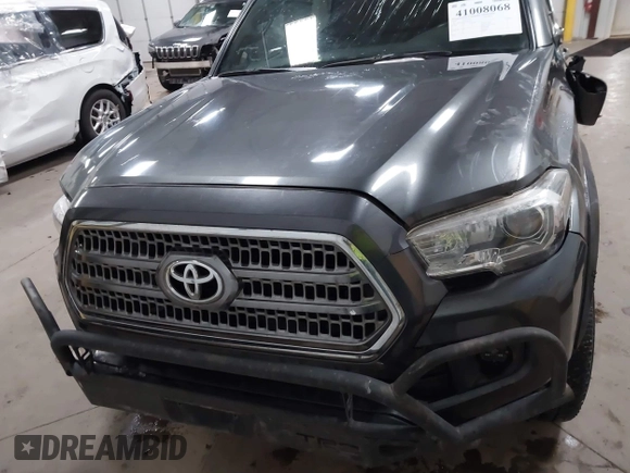 2016 Toyota Tacoma SR5 with VIN 3TMDZ5BNXGM009423, listed as a IAAI auction lot 41008068 with 107,426 mi miles and . Bid and sale history available at DreamBid. Image 12.