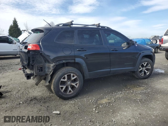 2014 Jeep Cherokee Trailhawk with VIN 1C4PJMBS9EW159993, listed as a Copart auction lot 46935105 with 128,140 mi miles and Salvage Title. Bid and sale history available at carsss.com. Image 3.