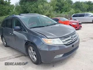 2011 Honda Odyssey Touring with VIN 5FNRL5H9XBB075209, listed as a IAAI auction lot 42571956 with Not provided miles and . Bid and sale history available at DreamBid. Image 1.