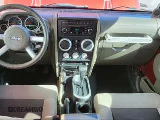 2010 Jeep Wrangler Unlimited Sahara with VIN 1J4BA5H10AL117474, listed as a IAAI auction lot 41969202 with 131,256 mi miles. Bid and sale history available at carsss.com. Image 11.